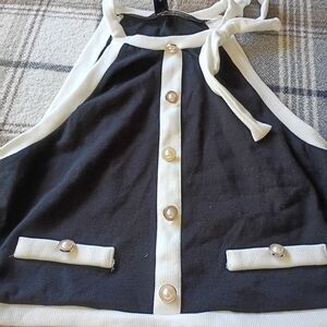 Black and White Sleeveless Top with Button Accents